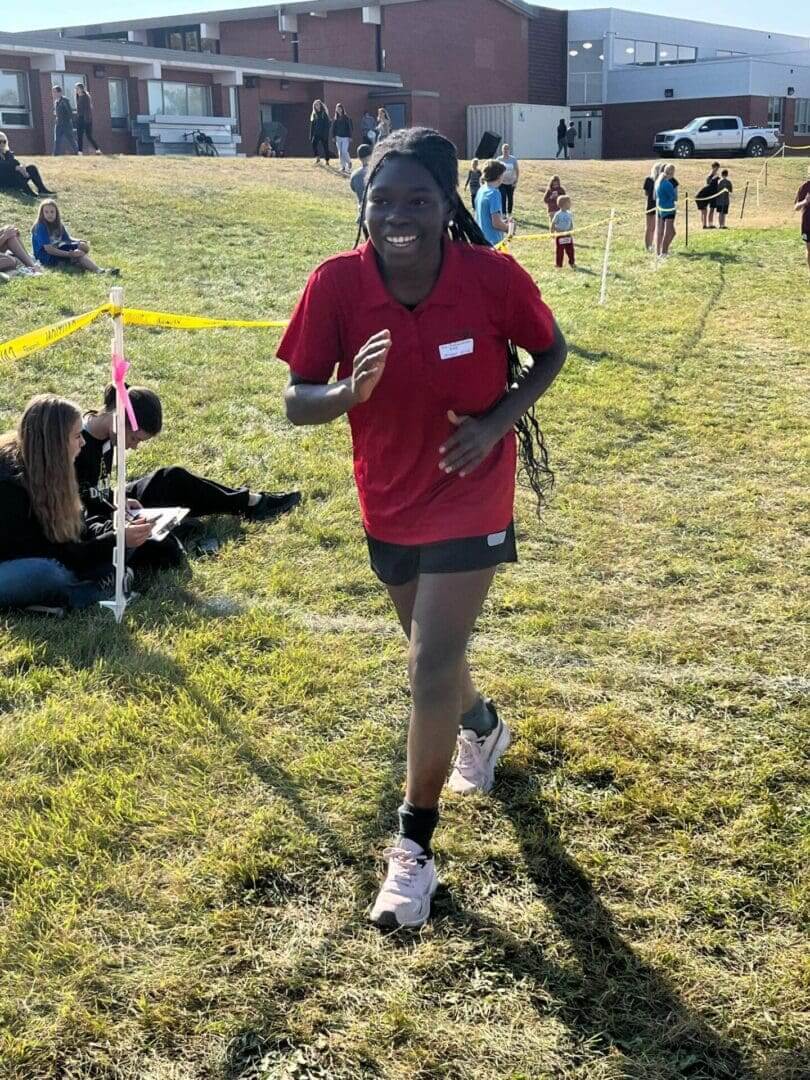 Smiling runner in red shirt outdoors