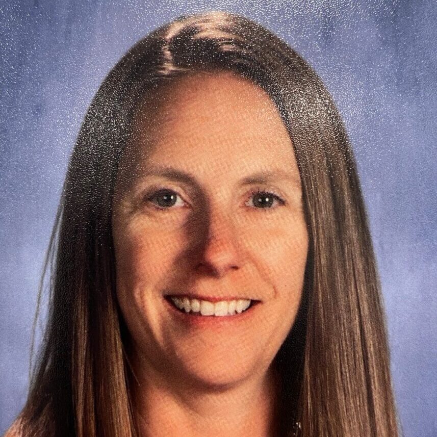 Smiling woman with long brown hair portrait