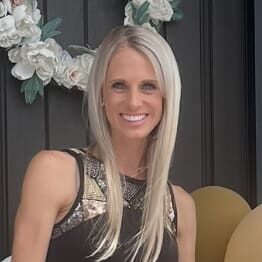 Smiling blonde woman with floral wreath