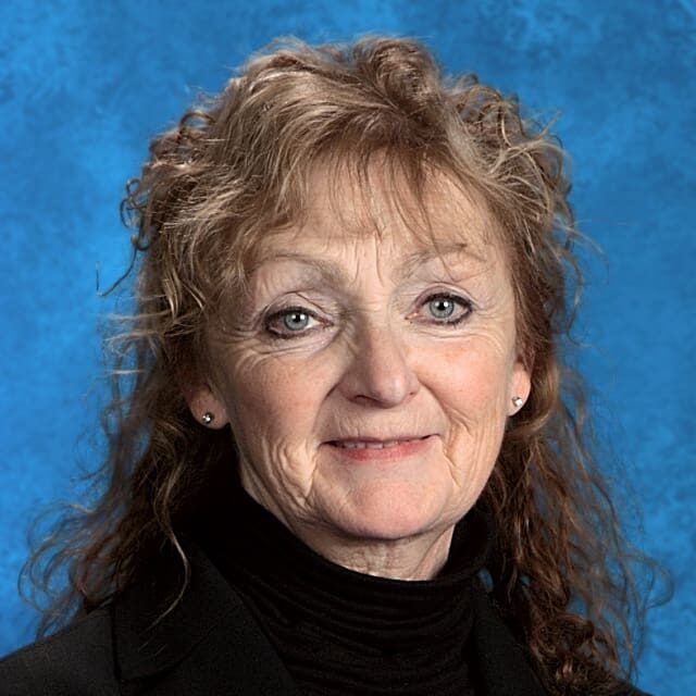 Portrait of a woman with wavy hair.