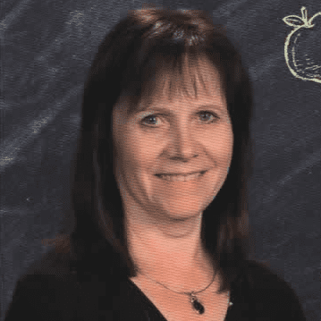 Smiling woman portrait with chalkboard background